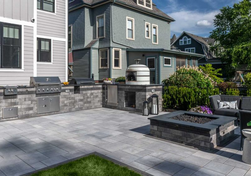 Outdoor Kitchen Space with Grill and Pizza Oven and Patio area with Outdoor Fire Pit