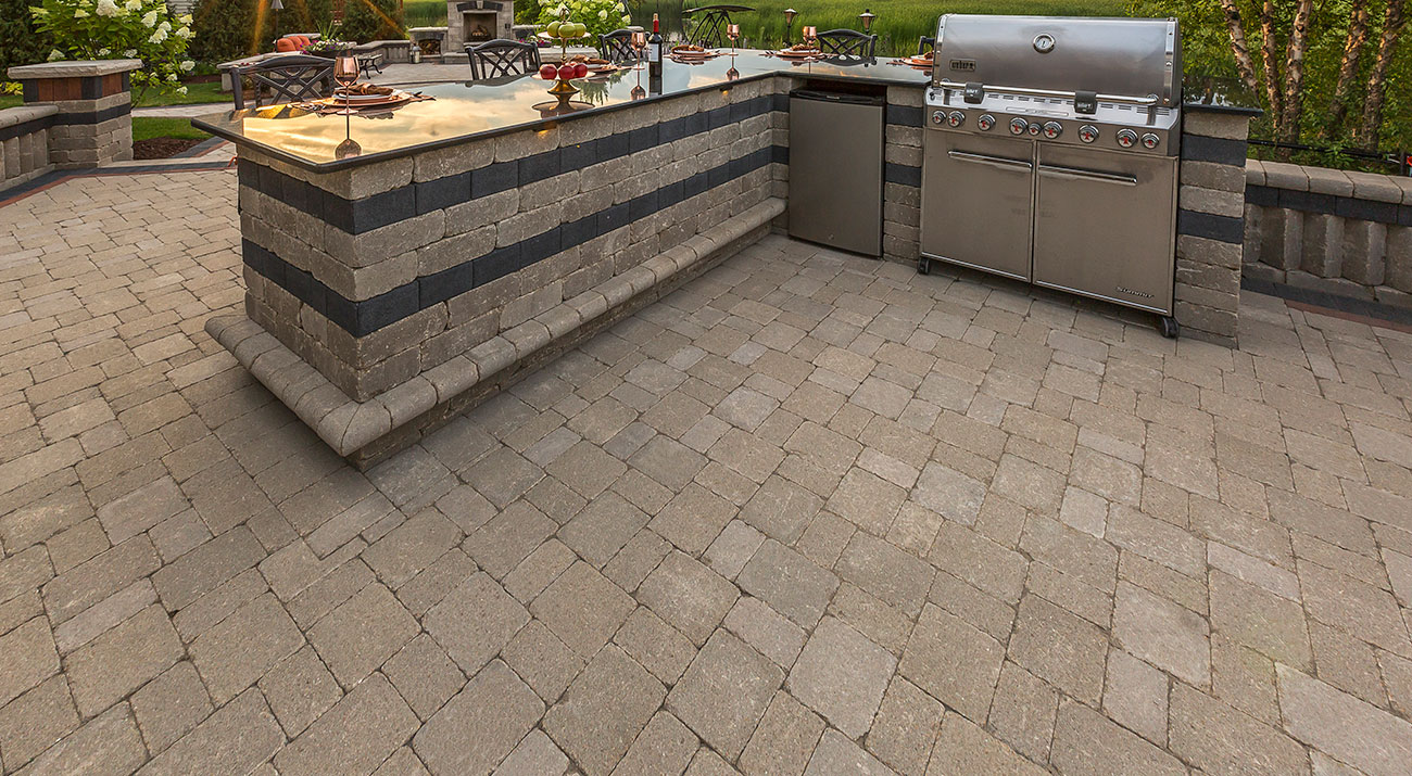 Rustic Outdoor Kitchen using Unilock Brussels Block pavers