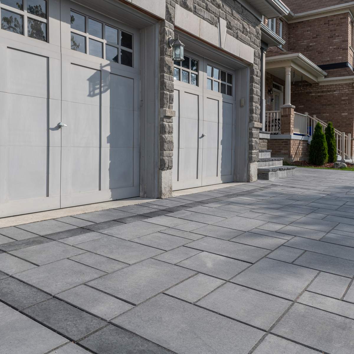 interlocking pavers in front of driveway garage