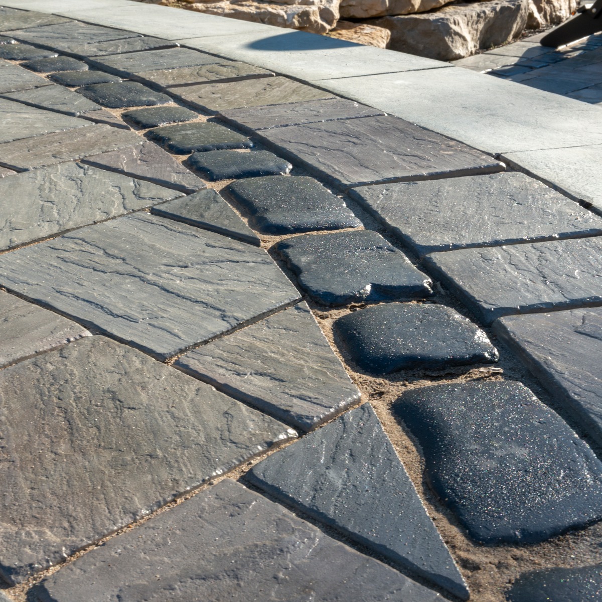 Unilock Richcliff patio pavers with Courtstone banding.