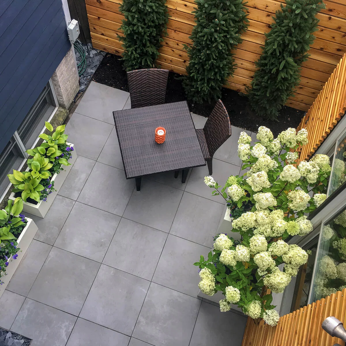 Birds Eye View of Small Outdoor Unilock Patio with Porcelain Tiles