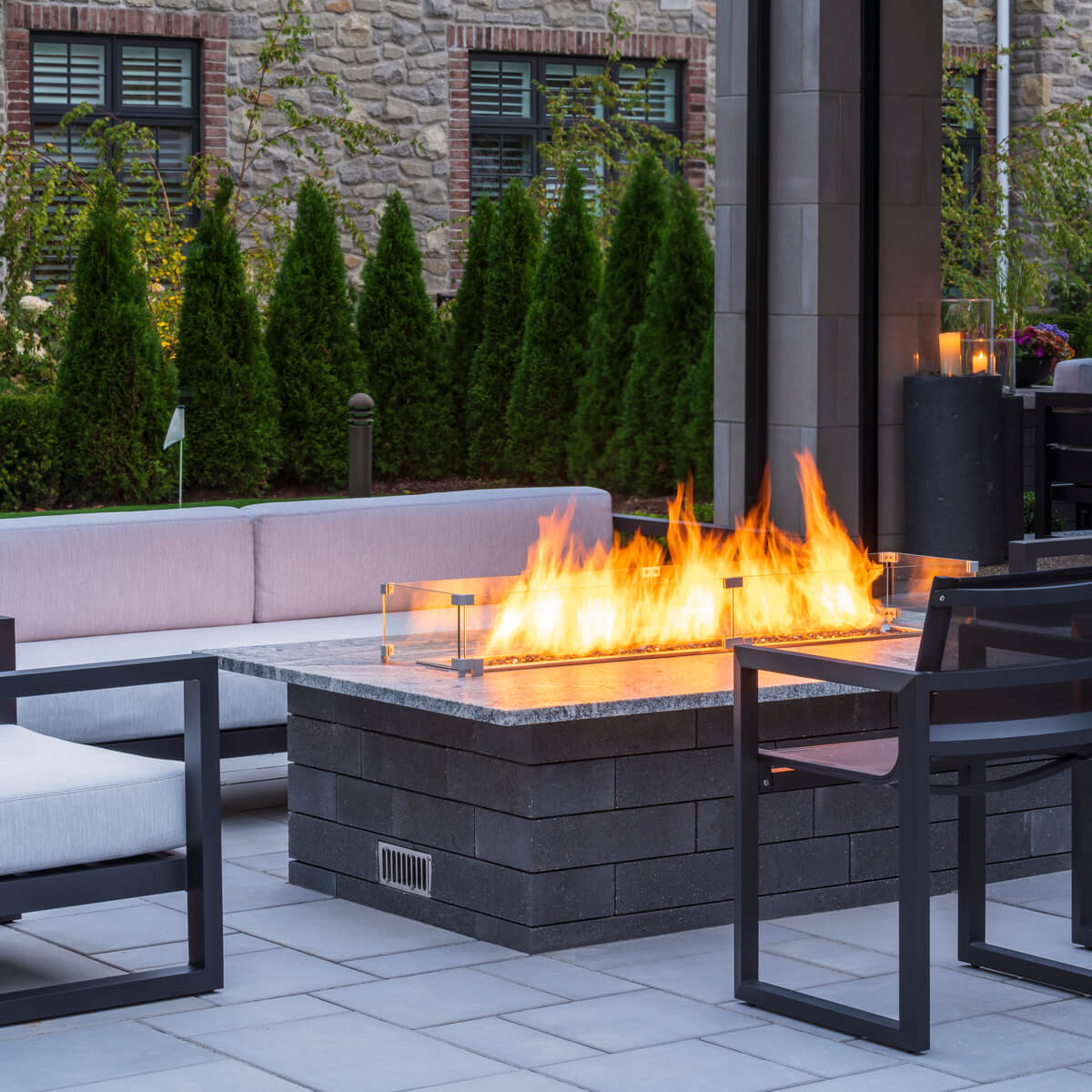 Modern Outdoor Unilock Fire Feature Table on Patio