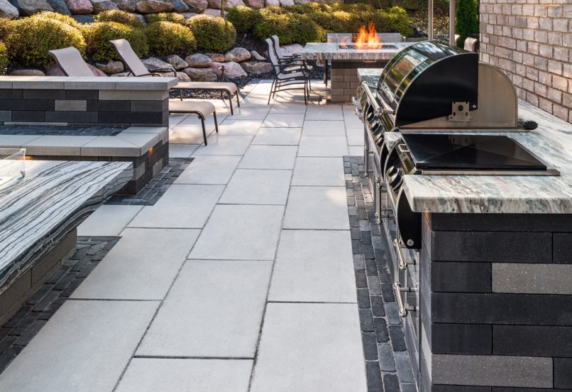 Close up of Outdoor Kitchen with Grill and Patio with Boarders