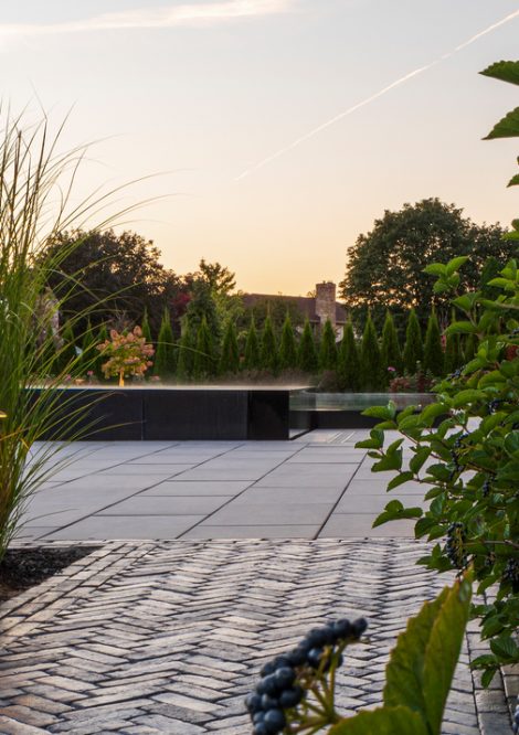 Unilock Interlocking Walkway to Pool Area Surrounded by Greenery