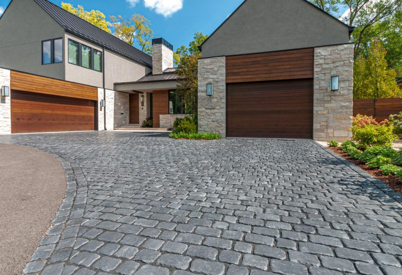 Curved Unilock Interlocking Driveway Dividing Pavers and Asphalt