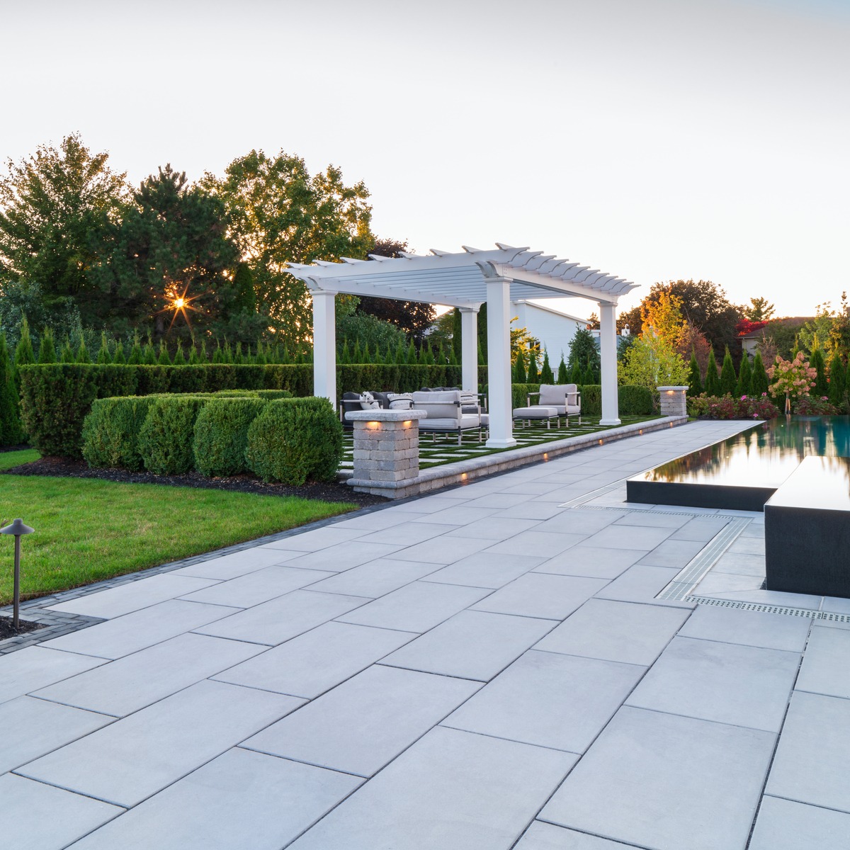 Large Concrete Paver Pool Deck with Pergola